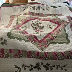 Elegant Holiday Quilt with Green and Red Accents